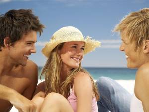 Girl with 2 guys on beach